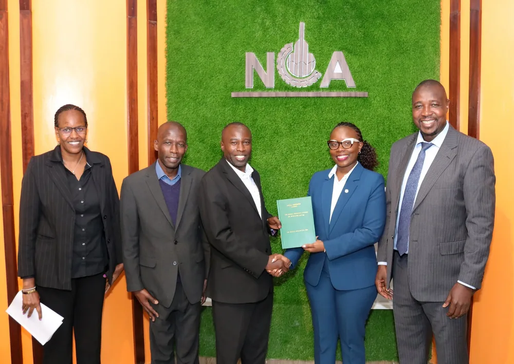 REBWAK representatives receiving the National Building Code, 2024 at the NCA