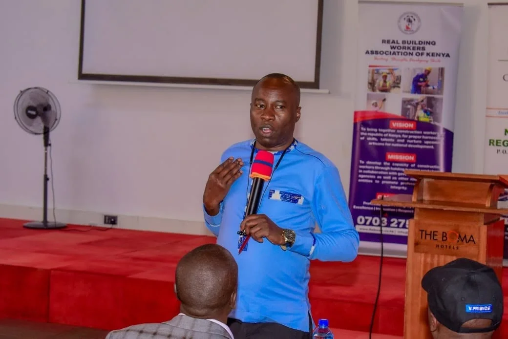 A REBWAK representative addressing participants at the Eldoret Construction Workers Forum