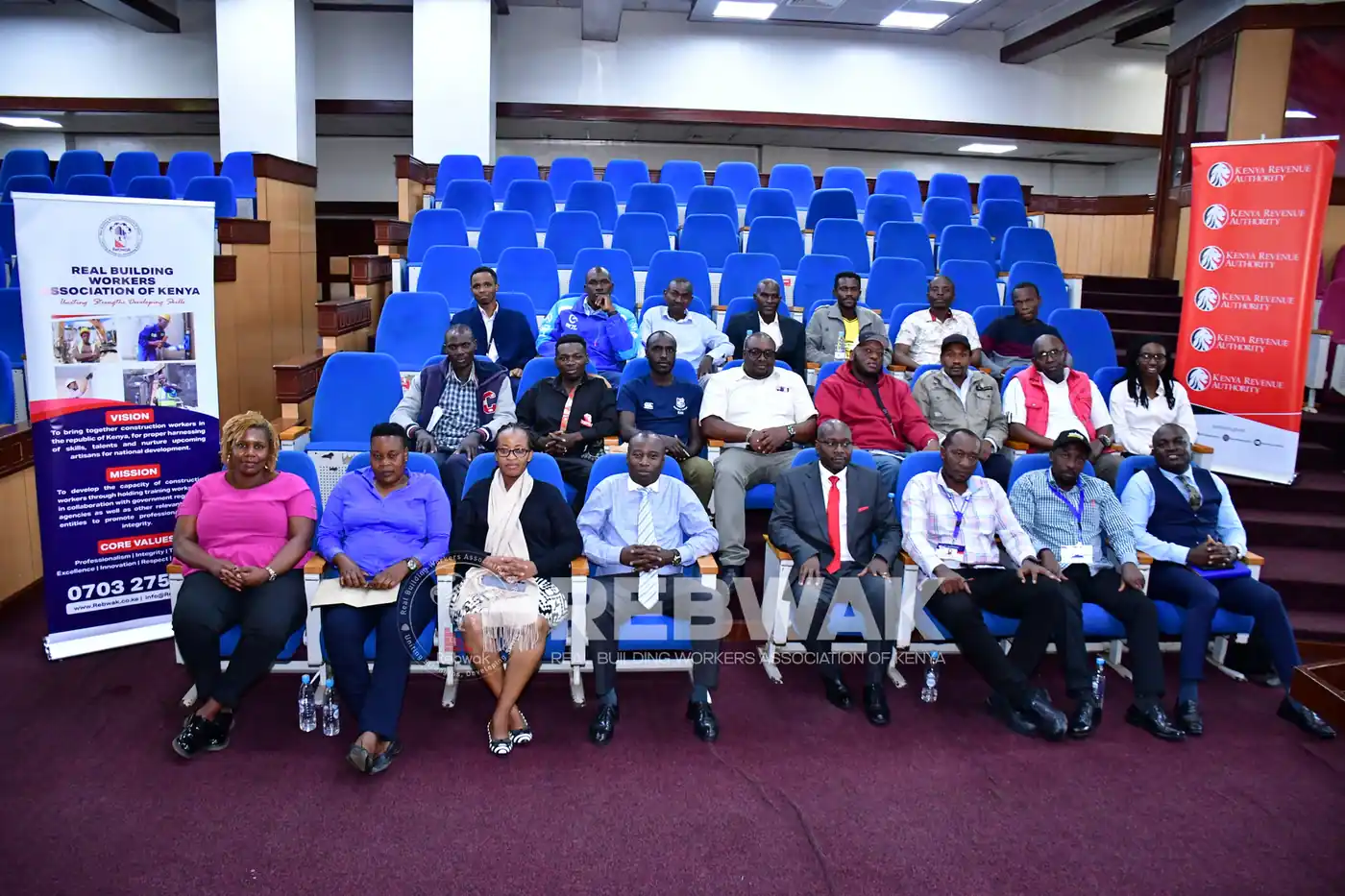 Group photo of officials and participants with REBWAK and Kenya Revenue Authority banners